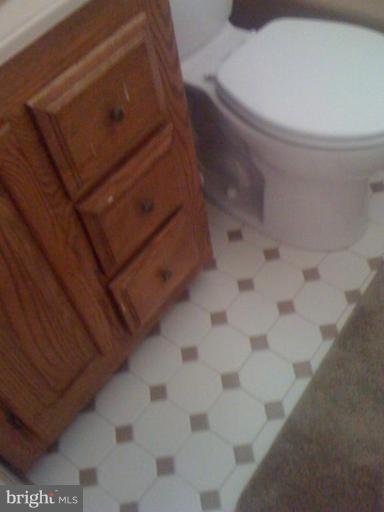 12829 Holdridge Road Silver Spring, MD 20906 - Photo 8 of 26 a bathroom with a toilet