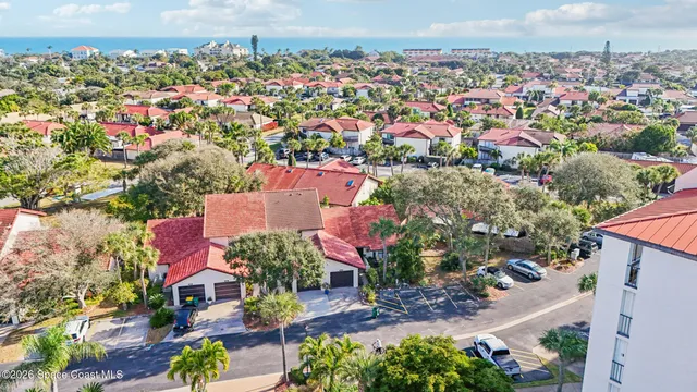 an aerial view of a houses with outdoor space and street view