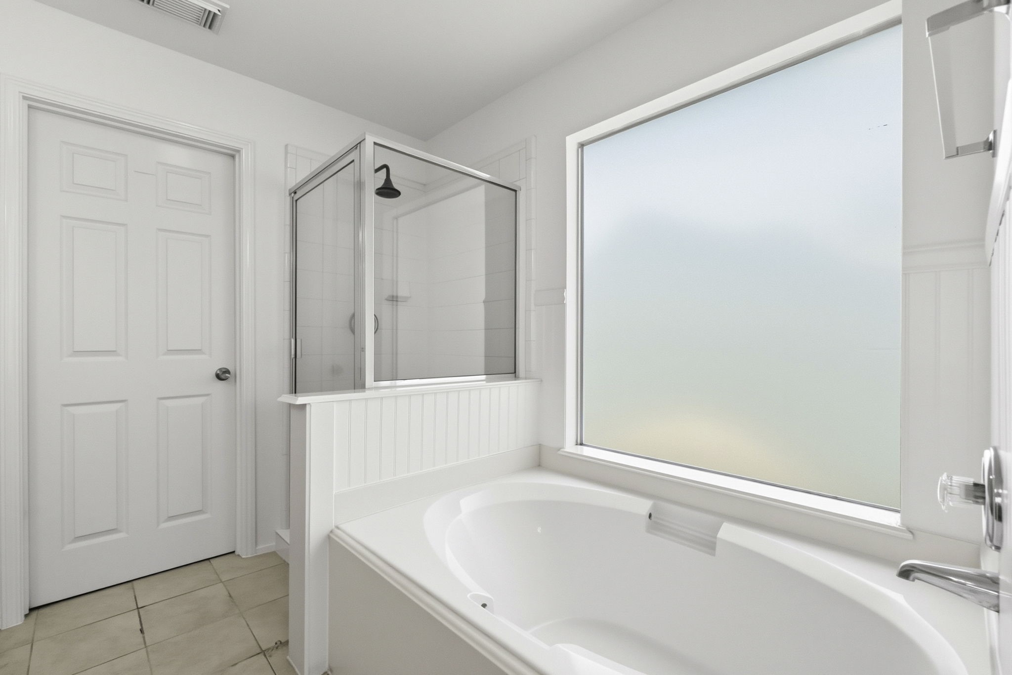 11907 Ezekiel Road Tomball, TX 77375 - Photo 28 of 39 a bathroom with a bathtub and a shower