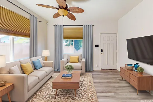 a living room with furniture and a flat screen tv