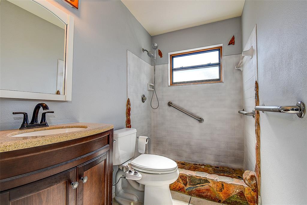 808 Helmsman Way Palm Harbor, FL 34685 - Photo 14 of 27 a bathroom with a sink a toilet and a shower