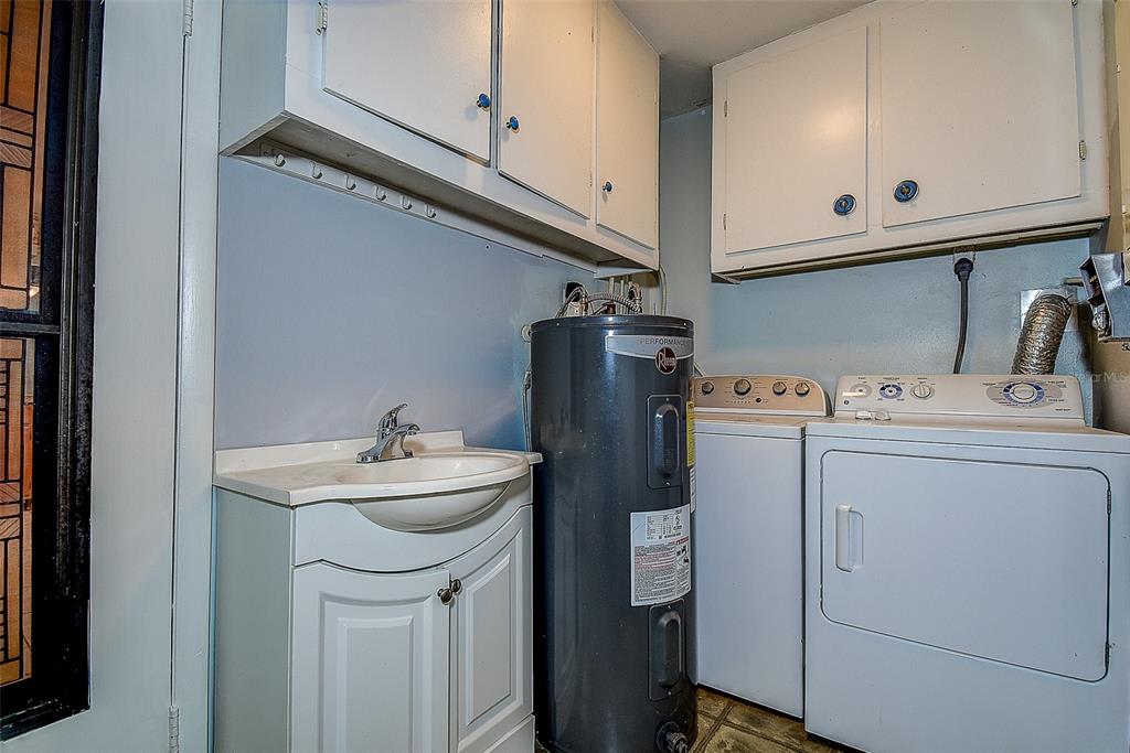 808 Helmsman Way Palm Harbor, FL 34685 - Photo 17 of 27 a utility room with dryer and washer