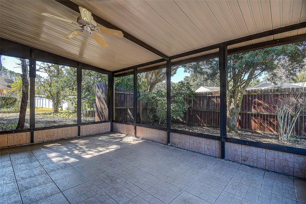808 Helmsman Way Palm Harbor, FL 34685 - Photo 18 of 27 a view of empty room with sliding windows