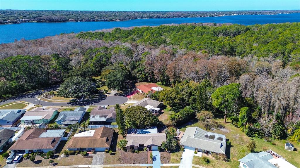 808 Helmsman Way Palm Harbor, FL 34685 - Photo 2 of 27 an aerial view of residential house with outdoor space and lake view