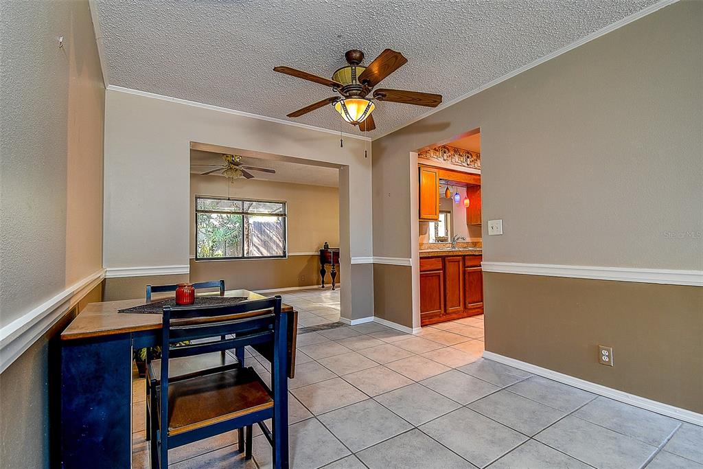 808 Helmsman Way Palm Harbor, FL 34685 - Photo 6 of 27 a workspace with wooden floor and a window