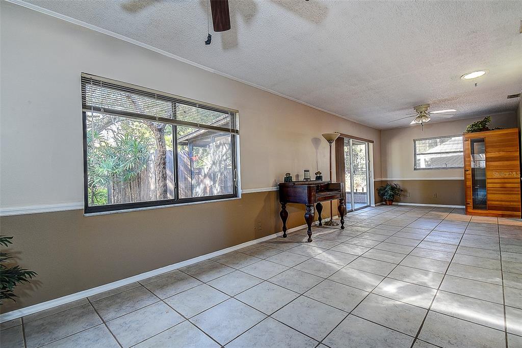 808 Helmsman Way Palm Harbor, FL 34685 - Photo 10 of 27 a living room with furniture and a window