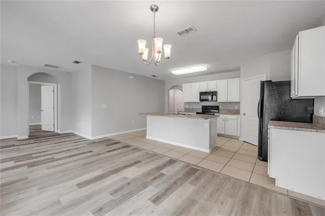 a bathroom with a toilet sink and shower