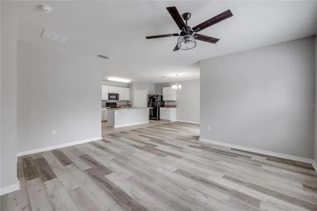 a view of a lake with houses in the back