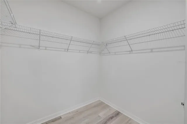 an aerial view of a houses with a yard