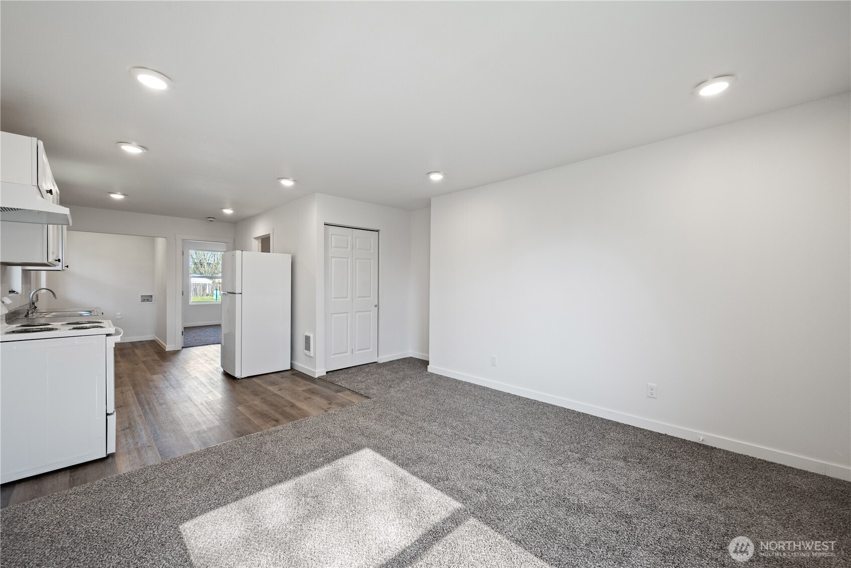 285 20th Avenue Longview, WA 98632 - Photo 23 of 37 a view of a kitchen with a sink and a refrigerator