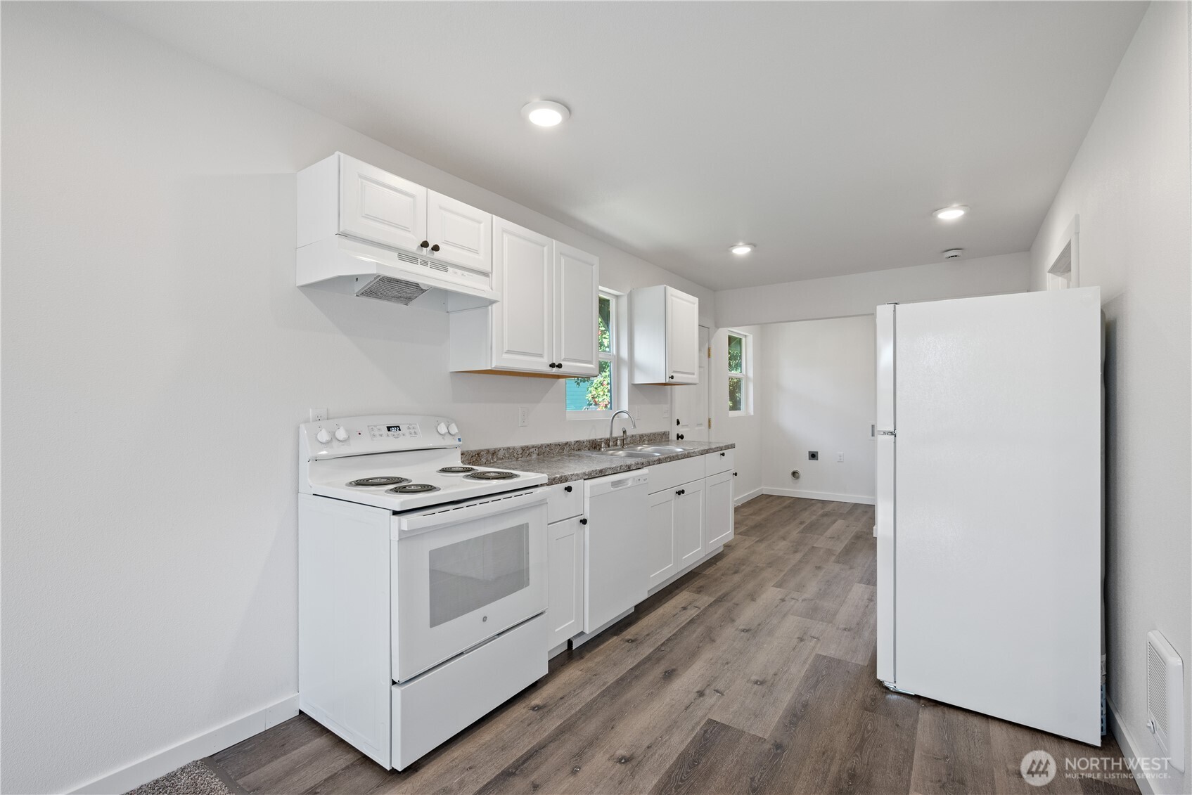 285 20th Avenue Longview, WA 98632 - Photo 27 of 37 a kitchen with stainless steel appliances granite countertop a stove a sink and a refrigerator