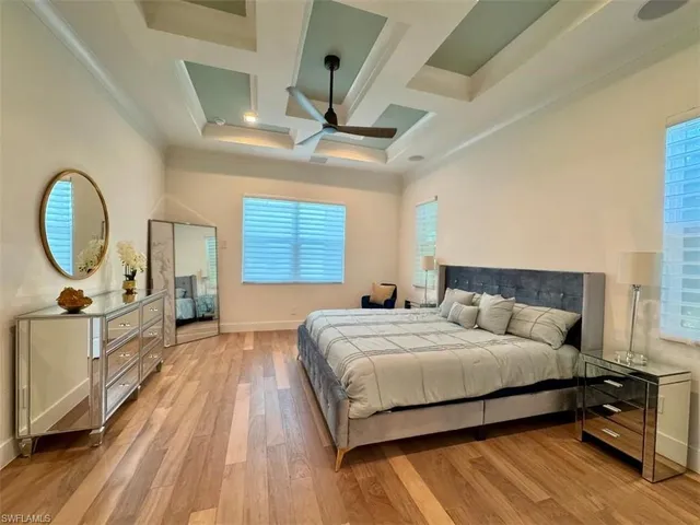 a bedroom with a bed and a table