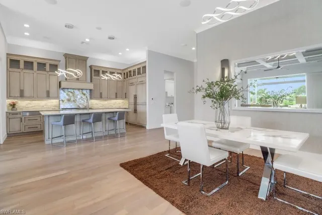 a living room with furniture window and wooden floor