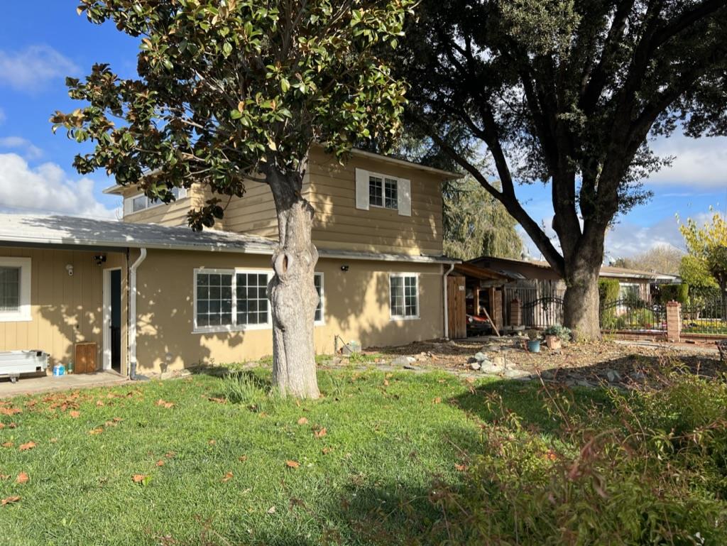 10381 Singleton Road San Jose, CA 95111 - Photo 1 of 2 a front view of a house with a yard
