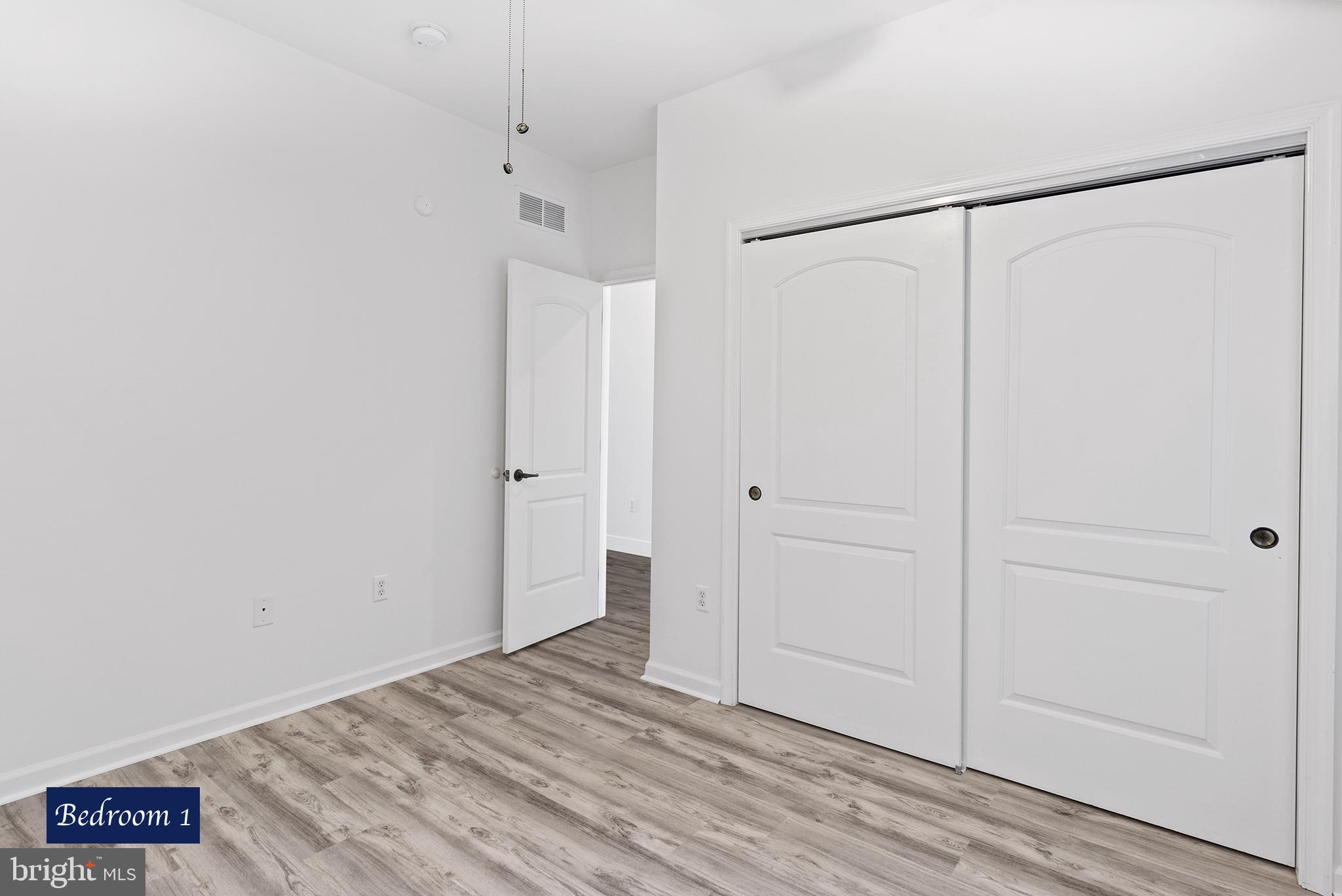 Bedroom 1 - New Flooring Double Closet
