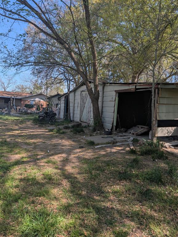 3395 Bonham Street Paris, TX 75460 - Photo 5 of 5 a view of a backyard of the house