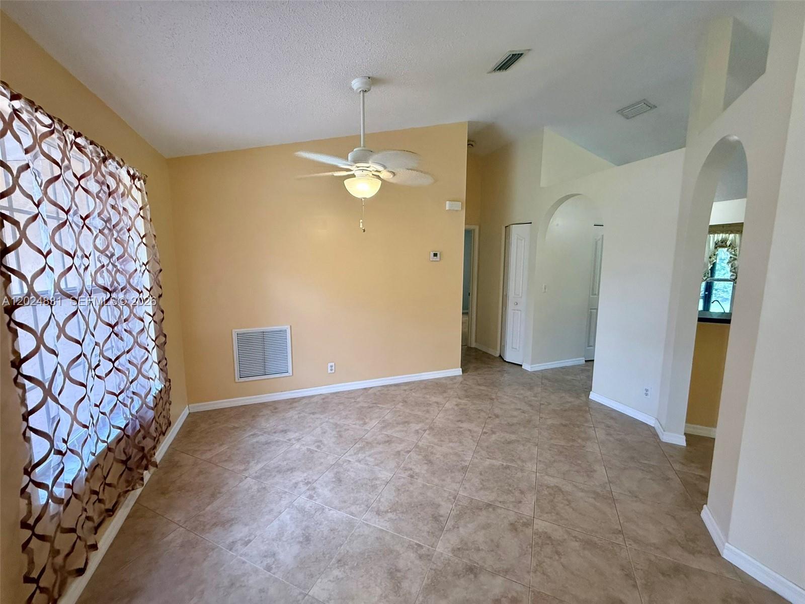 15819 76th Road North Loxahatchee, FL 33470 - Photo 11 of 45 wooden floor in an empty room with a window