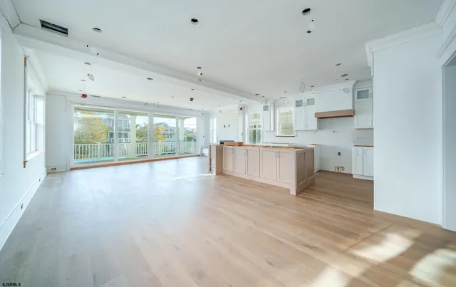 a view of kitchen with wooden floor and window