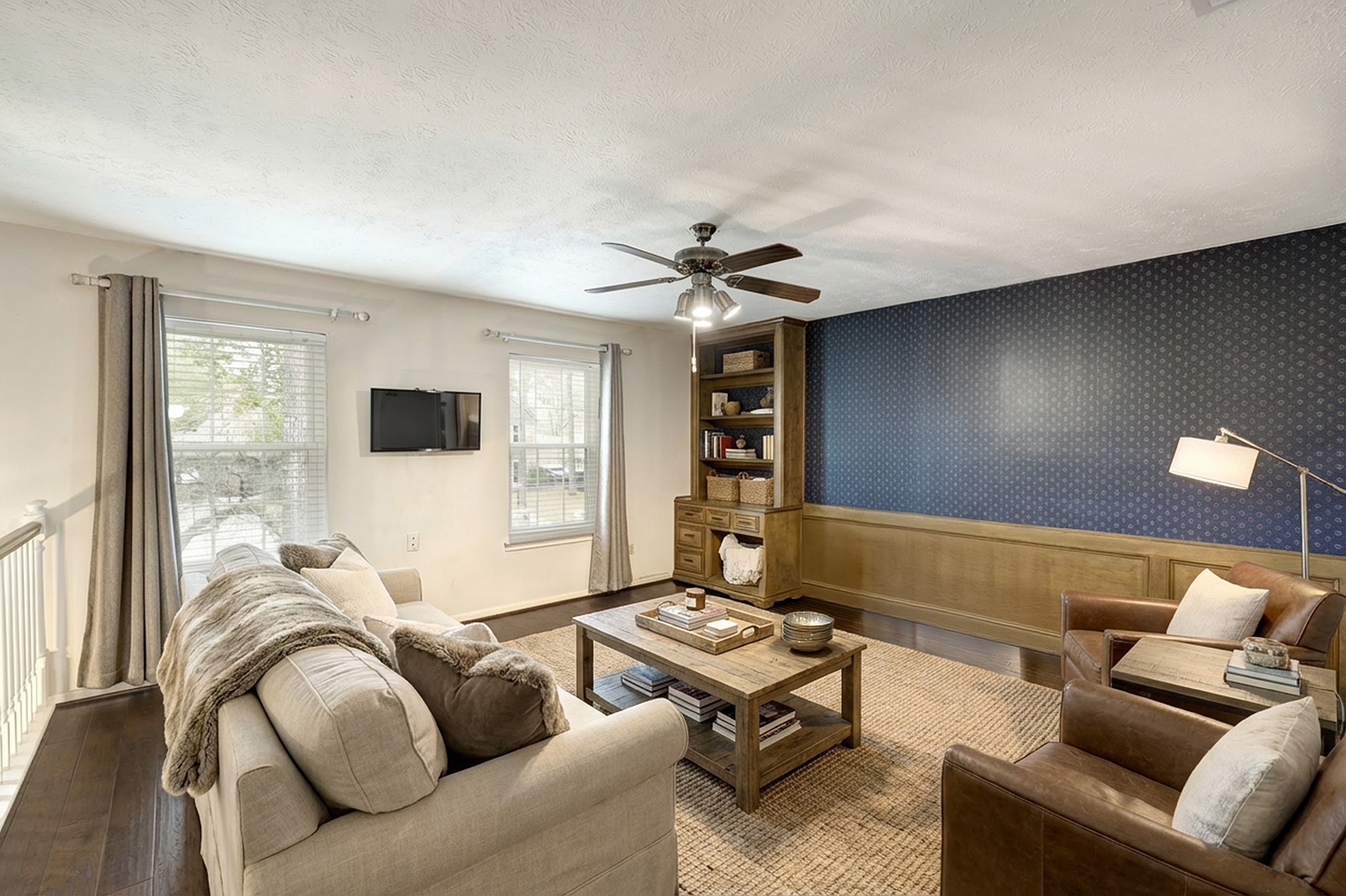 6623 Ampton Drive Spring, TX 77379 - Photo 16 of 26 a living room with furniture and a flat screen tv