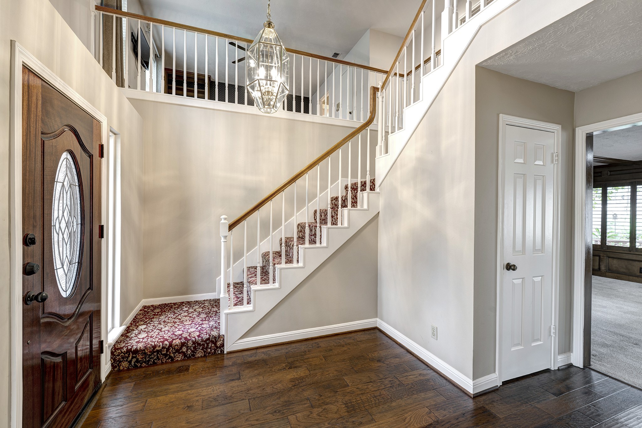6623 Ampton Drive Spring, TX 77379 - Photo 2 of 26 a view of entryway and hall with wooden floor