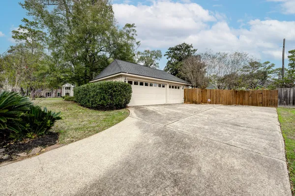 a view of backyard with large trees