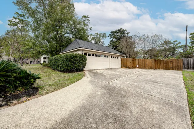 a view of backyard with large trees