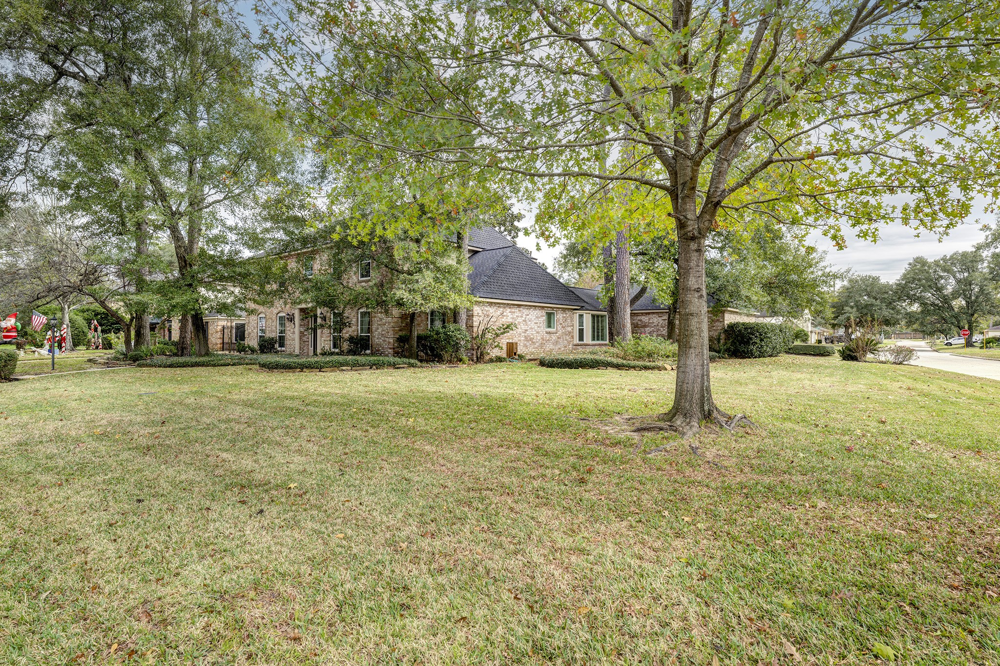 6623 Ampton Drive Spring, TX 77379 - Photo 25 of 26 a house with trees in front of it