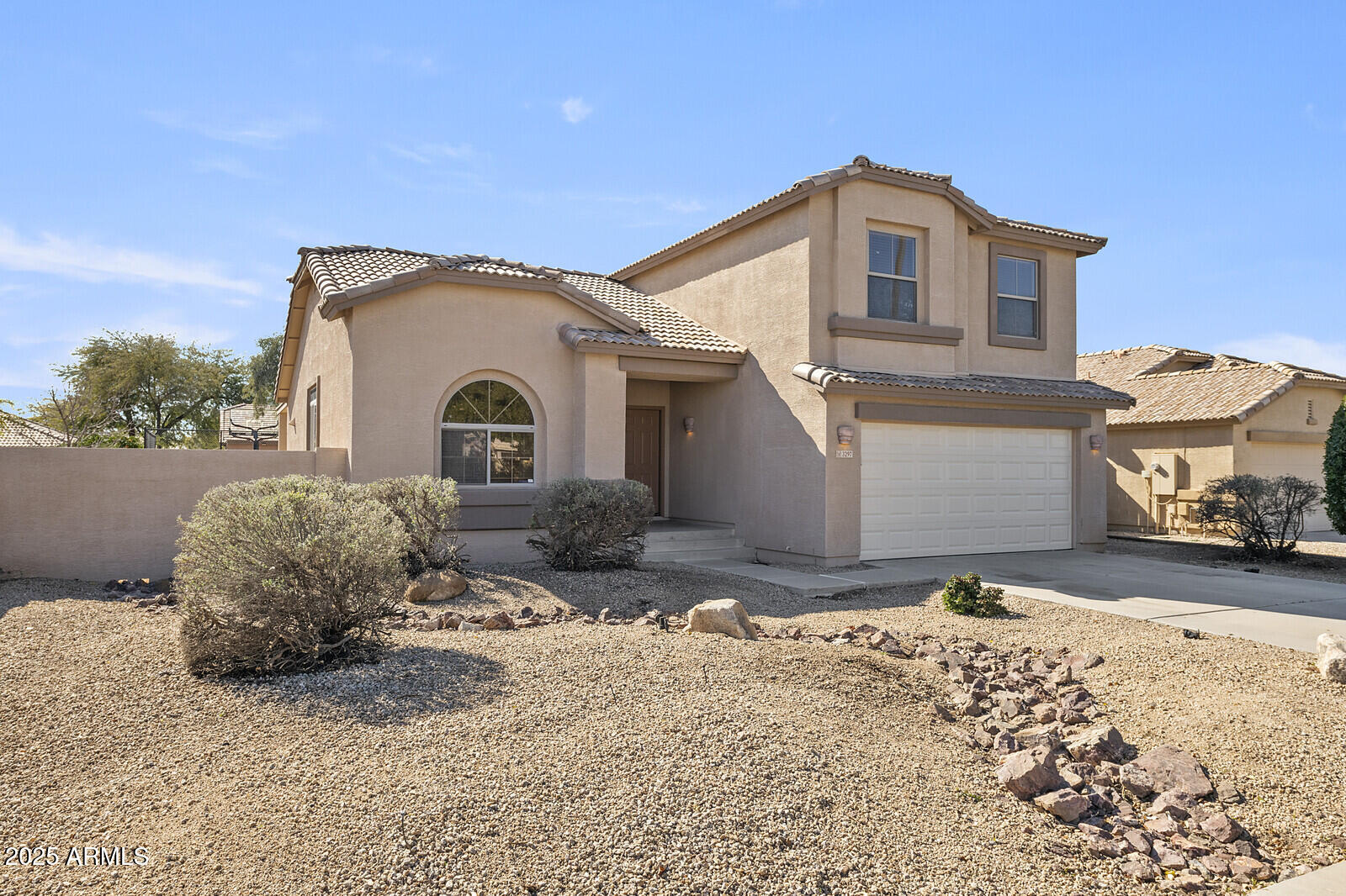 3297 East Warbler Road Gilbert, AZ 85297 - Photo 2 of 32 a front view of a house with a yard