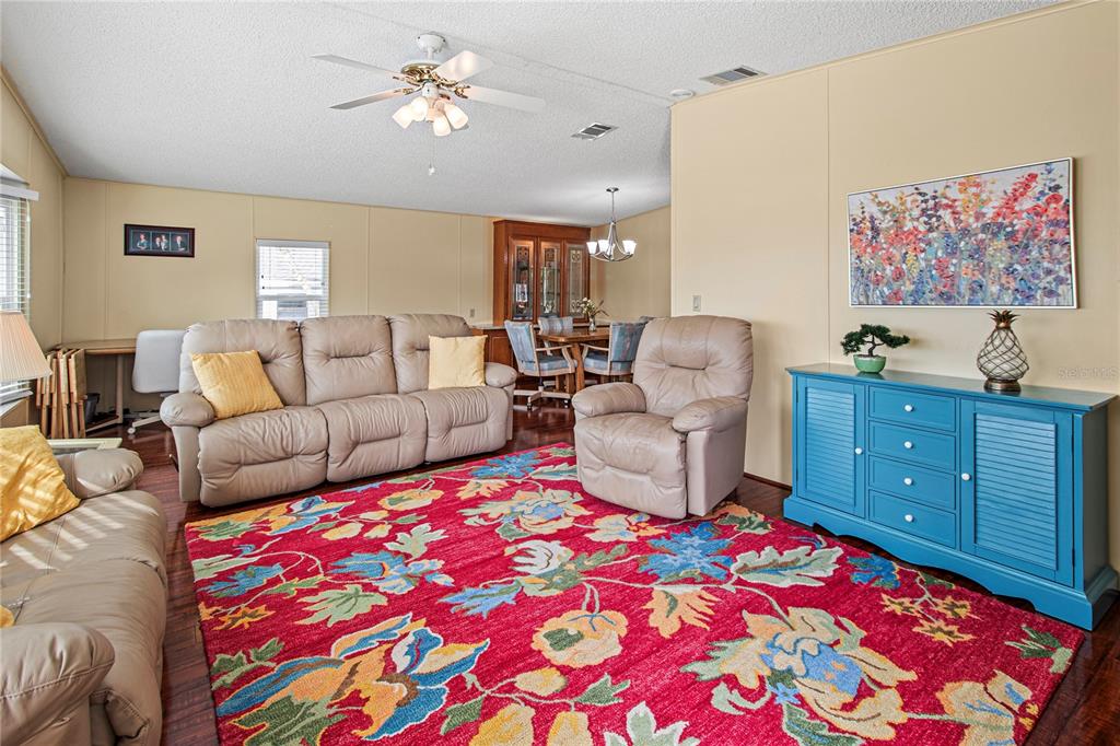 119 Mockingbird Lane Ellenton, FL 34222 - Photo 12 of 51 a living room with furniture and a lamp