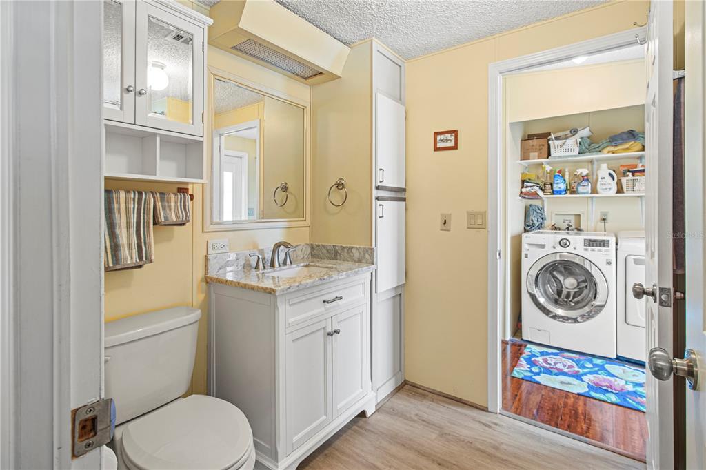 119 Mockingbird Lane Ellenton, FL 34222 - Photo 33 of 51 a bathroom with a sink a toilet and a mirror