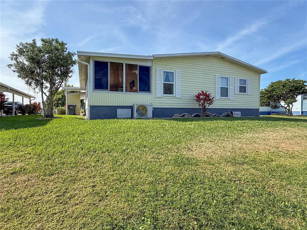 119 Mockingbird Lane Ellenton, FL 34222 - Photo 4 of 51 a view of a house with a yard and sitting area