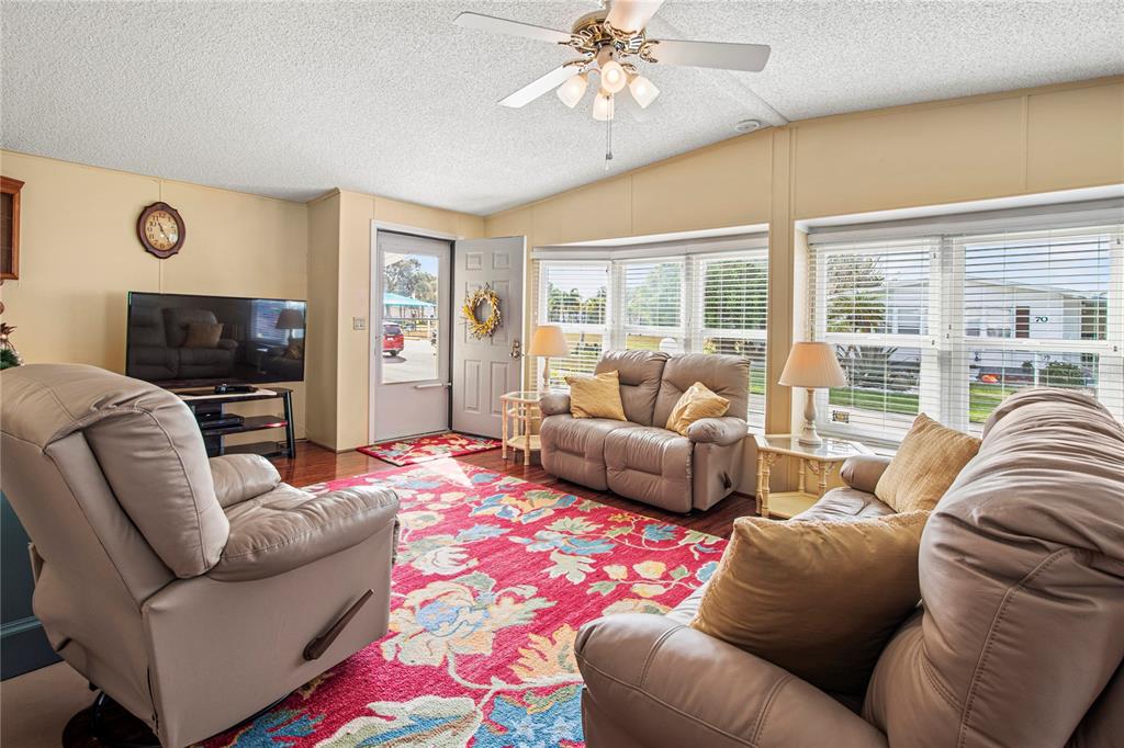 119 Mockingbird Lane Ellenton, FL 34222 - Photo 10 of 51 a living room with furniture and a fireplace