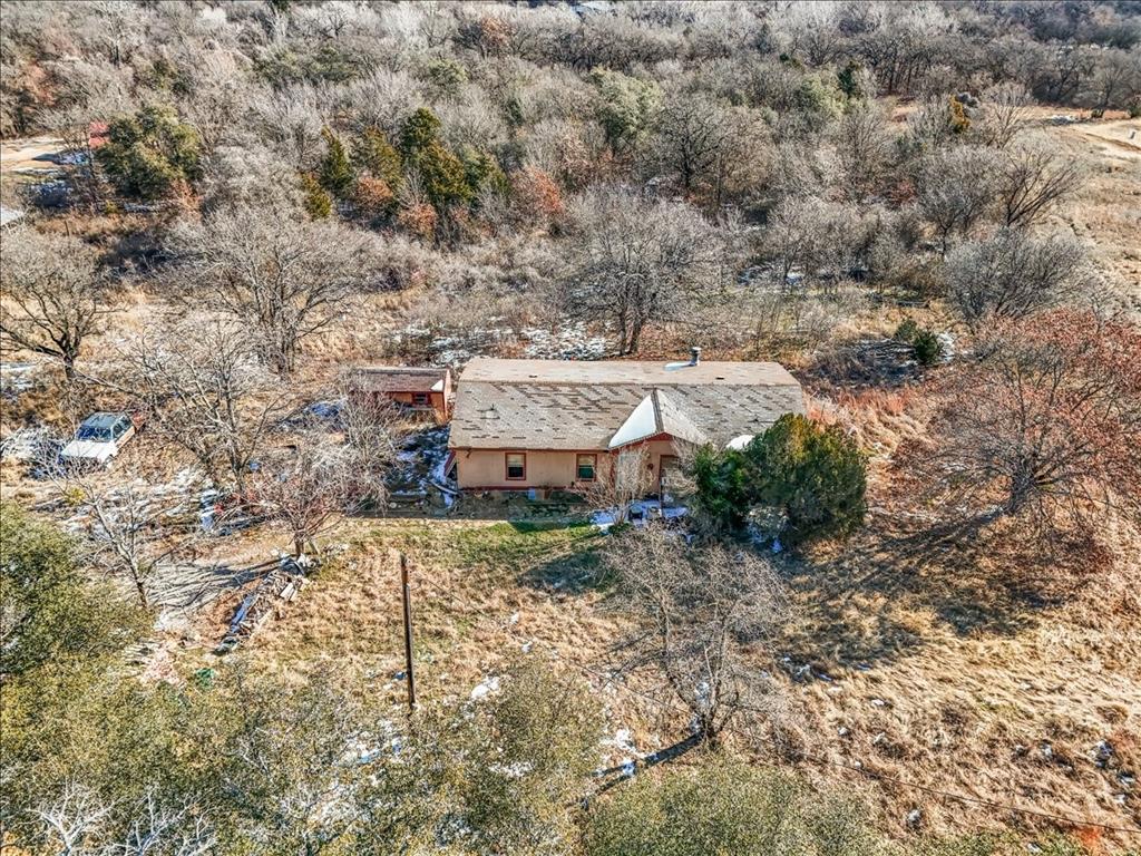 152 Private Road 3647 Springtown, TX 76082 - Photo 2 of 14 an aerial view of a house with a yard
