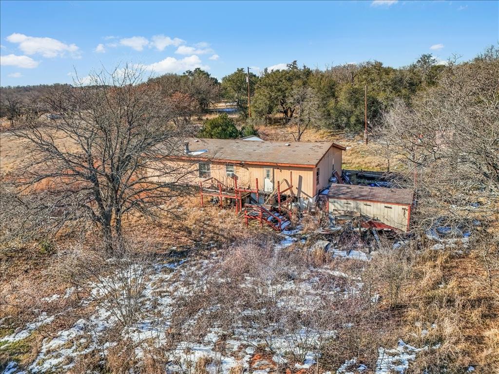 152 Private Road 3647 Springtown, TX 76082 - Photo 4 of 14 a view of a houses with a yard