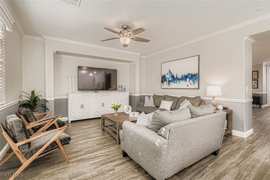 7055 Fort Tule Avenue Las Vegas, NV 89179 - Photo 13 of 75 Living room with crown molding, ceiling fan , open concept