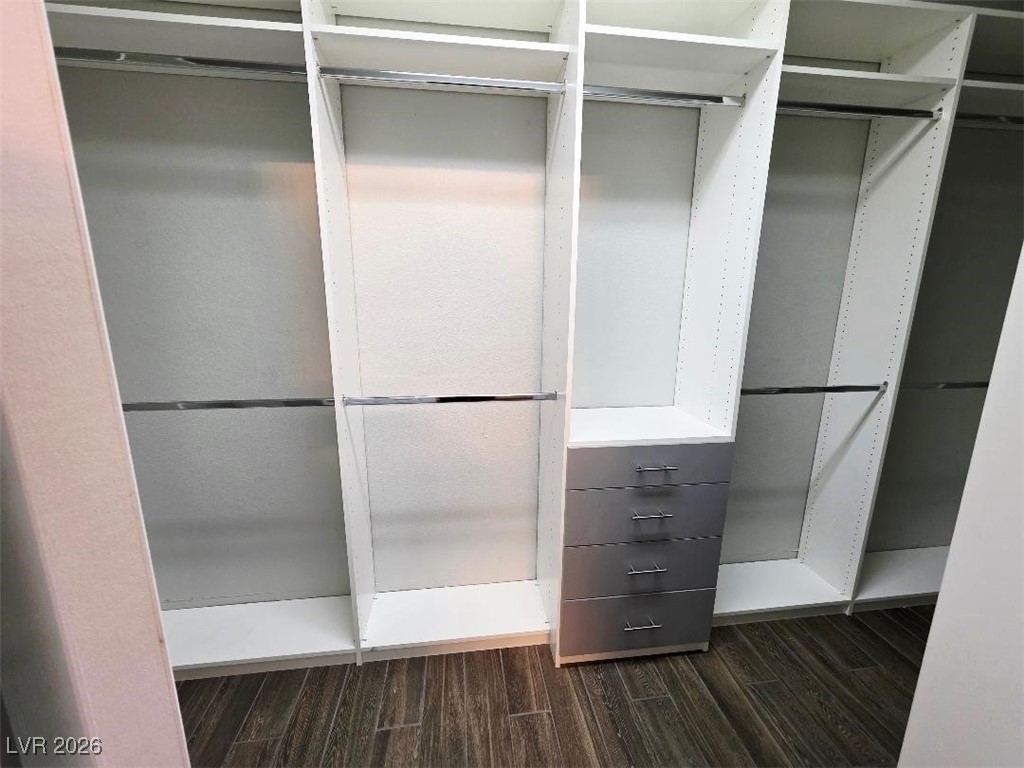 7055 Fort Tule Avenue Las Vegas, NV 89179 - Photo 20 of 75 Large Walk in closet featuring wood tiled floors