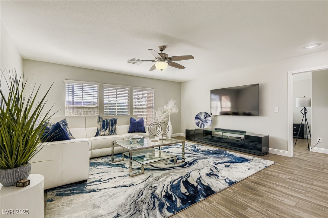 7055 Fort Tule Avenue Las Vegas, NV 89179 - Photo 26 of 75 over sized loft room with views of the mountains and ceiling fan plenty of natural light