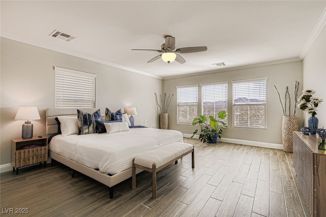 7055 Fort Tule Avenue Las Vegas, NV 89179 - Photo 28 of 75 Large 2nd Primary upstairs featuring crown molding, Tile finished floors, and a ceiling fan Large Walk in closet Views of the beautiful mountains