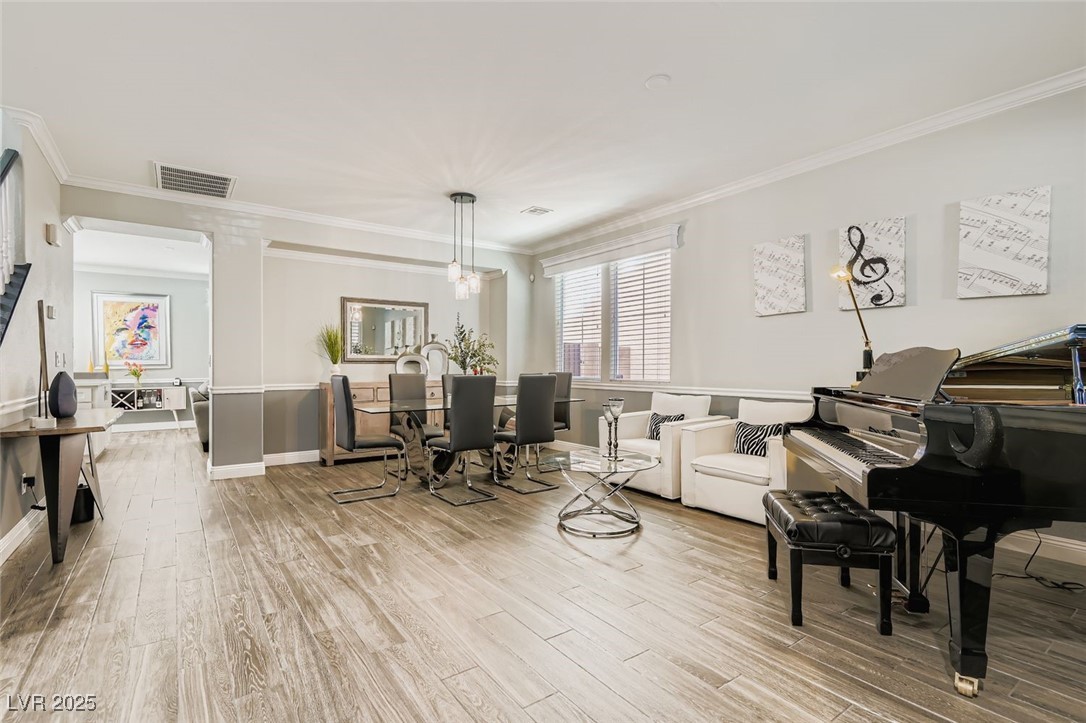7055 Fort Tule Avenue Las Vegas, NV 89179 - Photo 3 of 75 Living area featuring ornamental molding, light tile flooring, and decorative columns