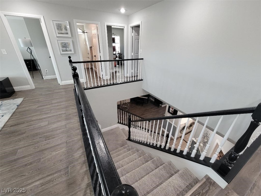 7055 Fort Tule Avenue Las Vegas, NV 89179 - Photo 32 of 75 Stairway with custom carpet and tile finished floors and baseboards