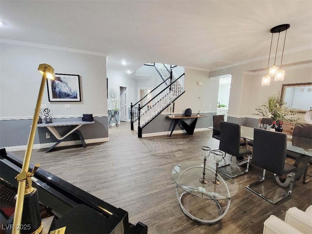 7055 Fort Tule Avenue Las Vegas, NV 89179 - Photo 5 of 75 Dining area featuring stairway, crown molding, and tile finished floors