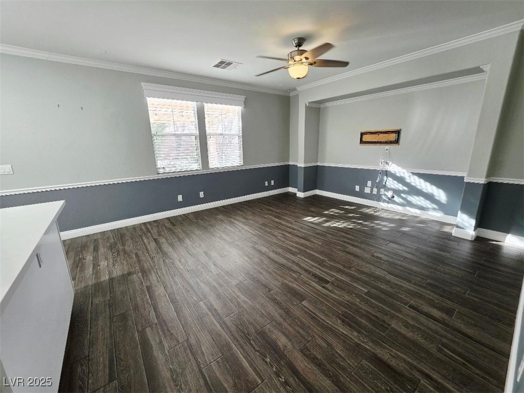 7055 Fort Tule Avenue Las Vegas, NV 89179 - Photo 52 of 75 living room with crown molding, dark tile finished floors, and ceiling fan