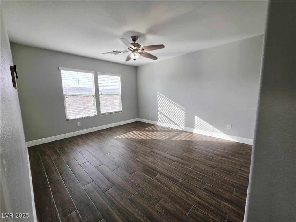 7055 Fort Tule Avenue Las Vegas, NV 89179 - Photo 54 of 75 Spare room with wood tiled floors and a ceiling fan