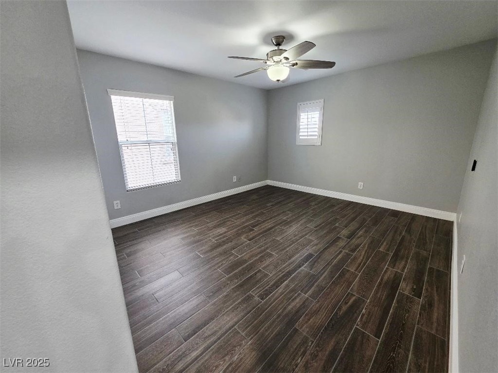 7055 Fort Tule Avenue Las Vegas, NV 89179 - Photo 55 of 75 Unfurnished room featuring wood tiled floors and ceiling fan