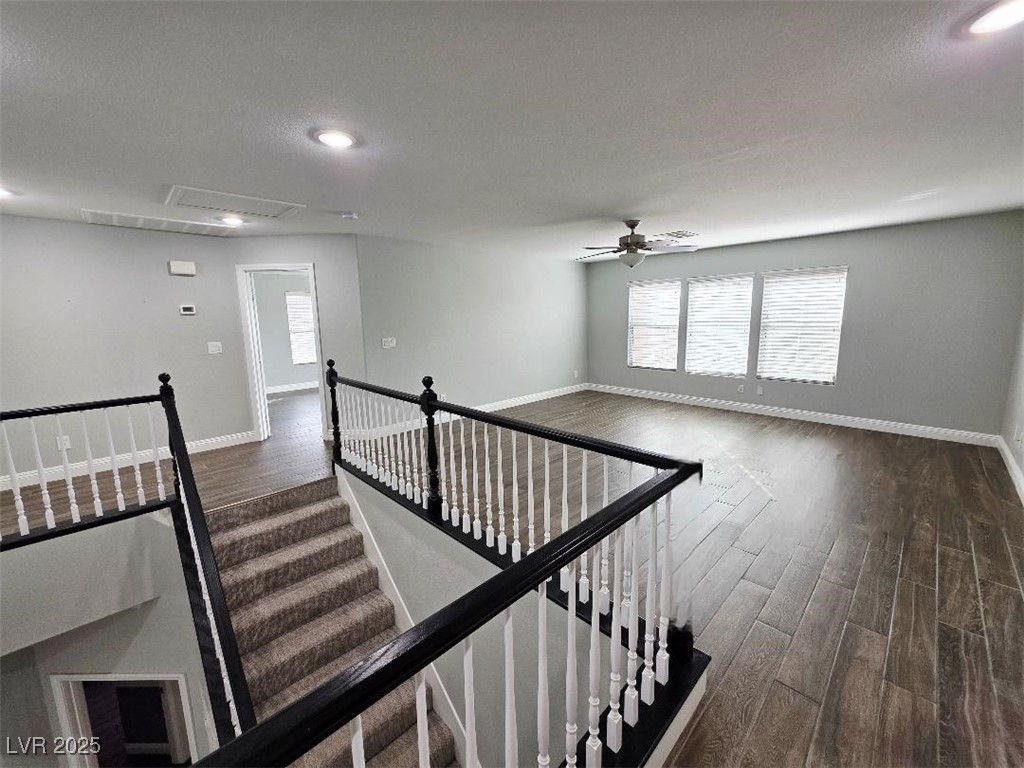 7055 Fort Tule Avenue Las Vegas, NV 89179 - Photo 58 of 75 Stairway featuring a textured ceiling, tile finished floors, healthy amount of natural light, recessed lighting, and ceiling fan