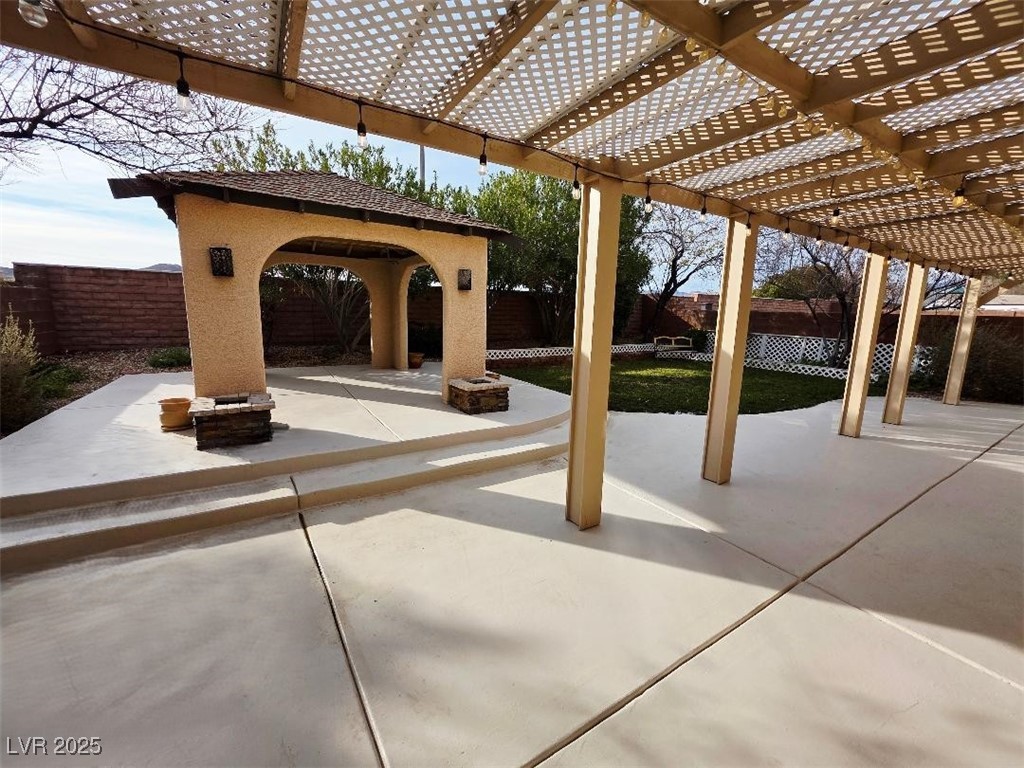 7055 Fort Tule Avenue Las Vegas, NV 89179 - Photo 71 of 75 Fenced backyard featuring a patio area and a pergola