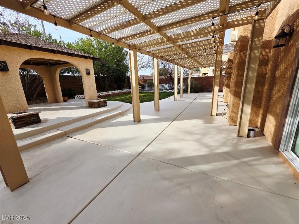 7055 Fort Tule Avenue Las Vegas, NV 89179 - Photo 72 of 75 Fenced backyard with a patio area and a pergola