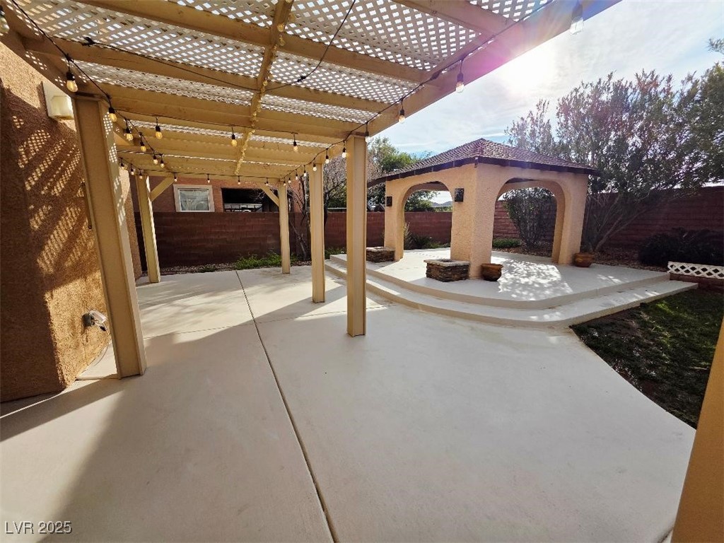 7055 Fort Tule Avenue Las Vegas, NV 89179 - Photo 74 of 75 Fenced backyard with a patio and a pergola