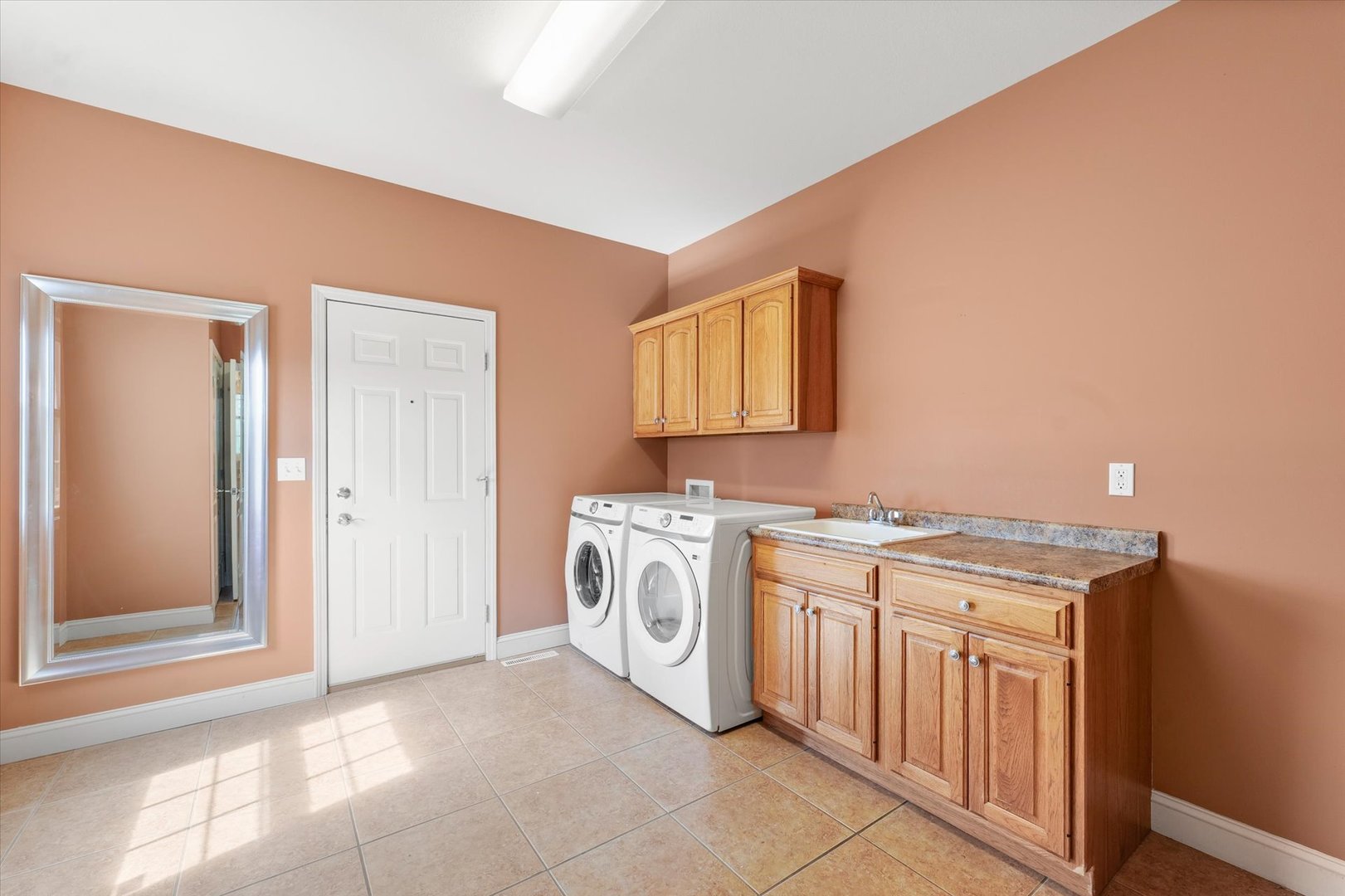 1818 Benodot Street Champaign, IL 61822 - Photo 12 of 41 a kitchen with stainless steel appliances granite countertop a stove a sink and a microwave