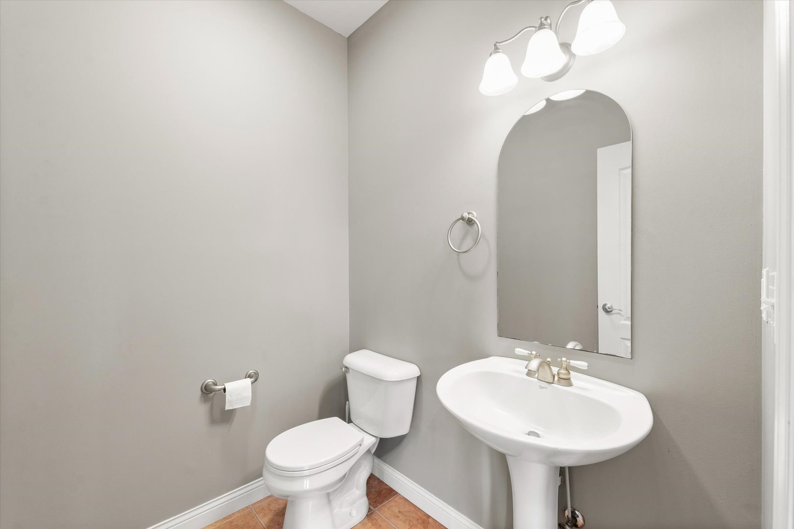 1818 Benodot Street Champaign, IL 61822 - Photo 22 of 41 a bathroom with a toilet sink and mirror